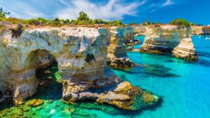 Limestone sea stacks and cliffs above turquoise water on Puglia’s Adriatic coast